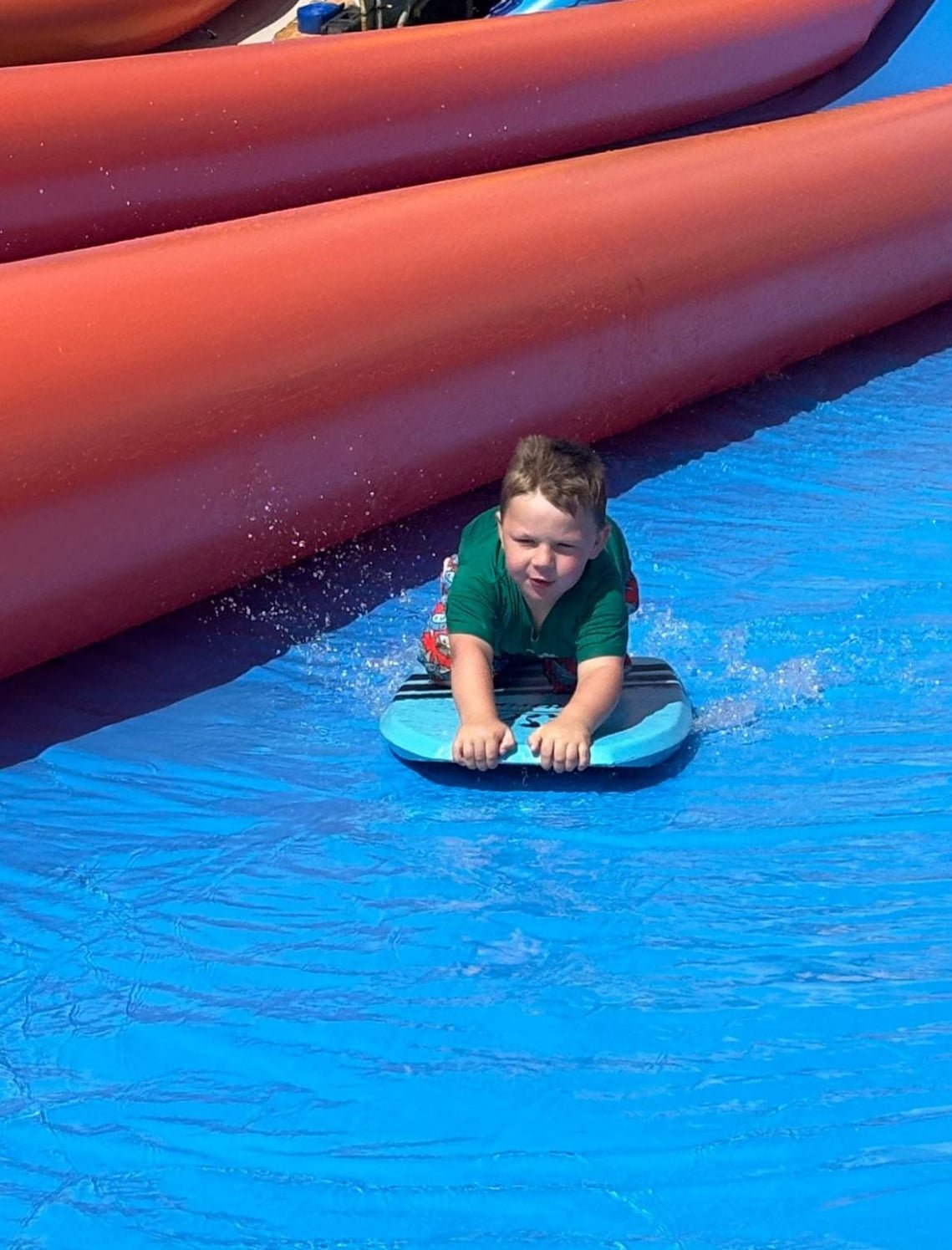 Riders racing down the slide in the countryside